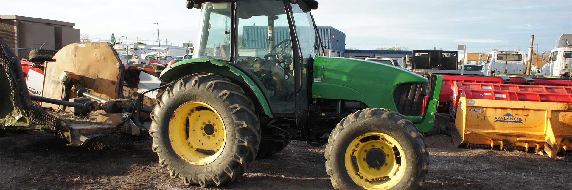 John Deere tractor with various other types of equipment